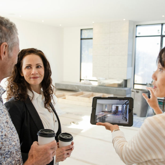 couple-viewing-remodel-flythrough-with-designer